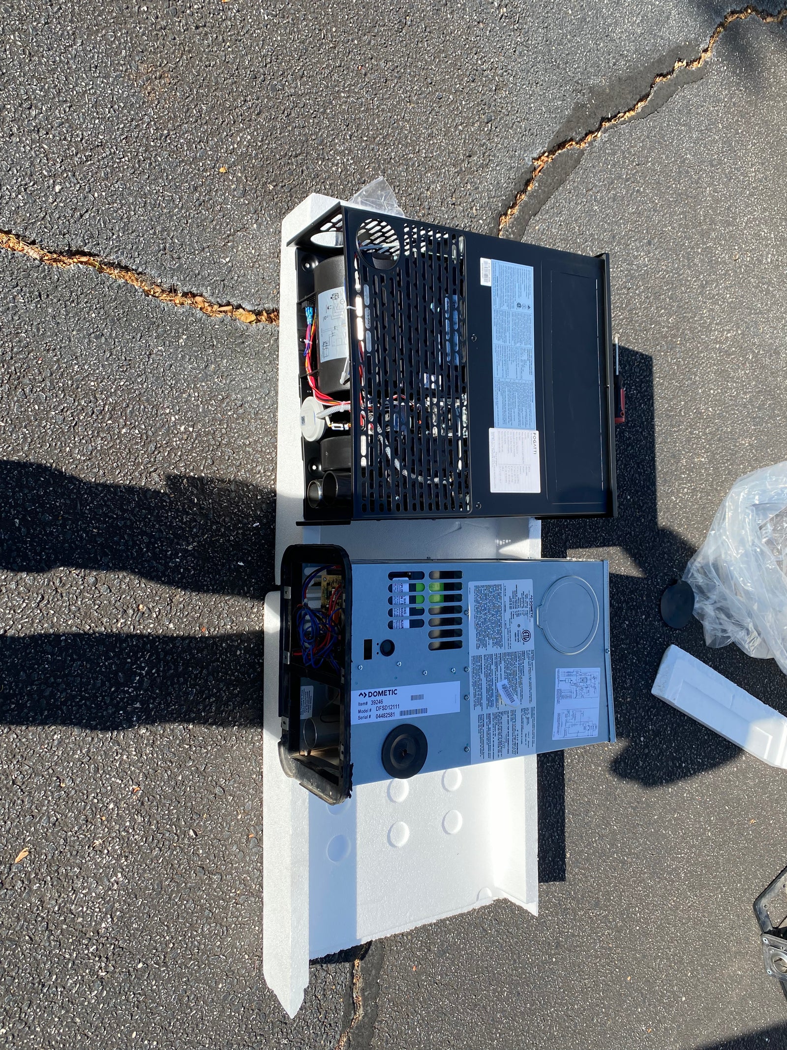 Two RV furnace assemblies prepared for diagnostic inspection and replacement