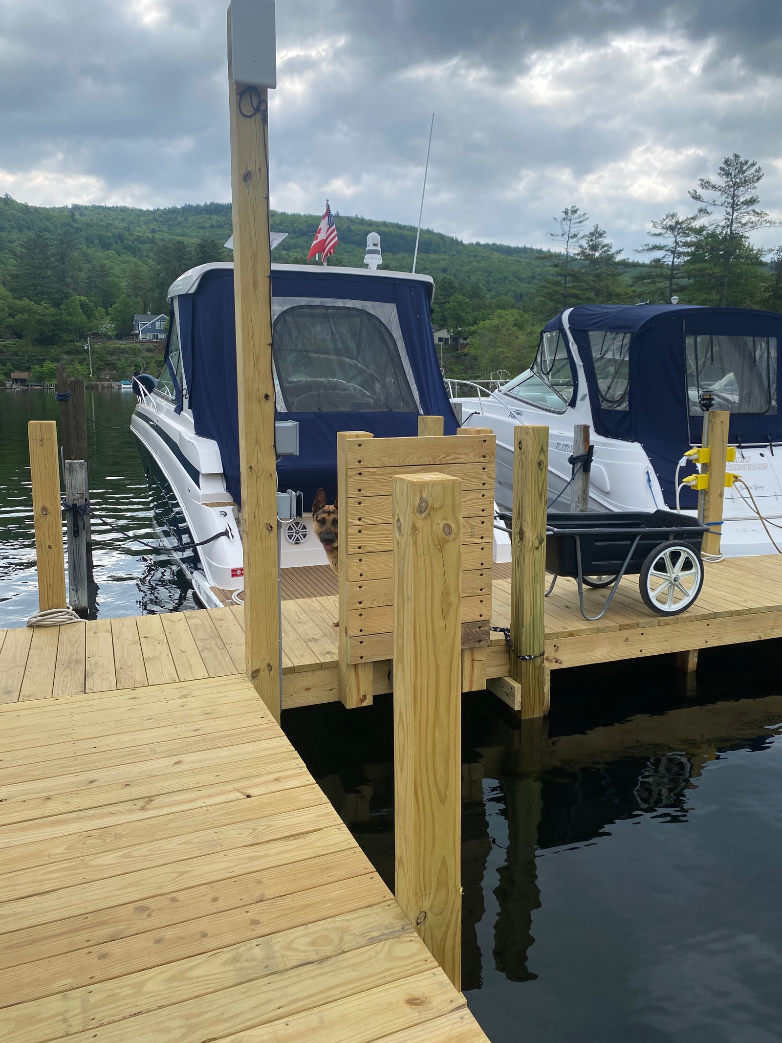 Cruiser at a dock with shore connections and a communications unit mounted nearby